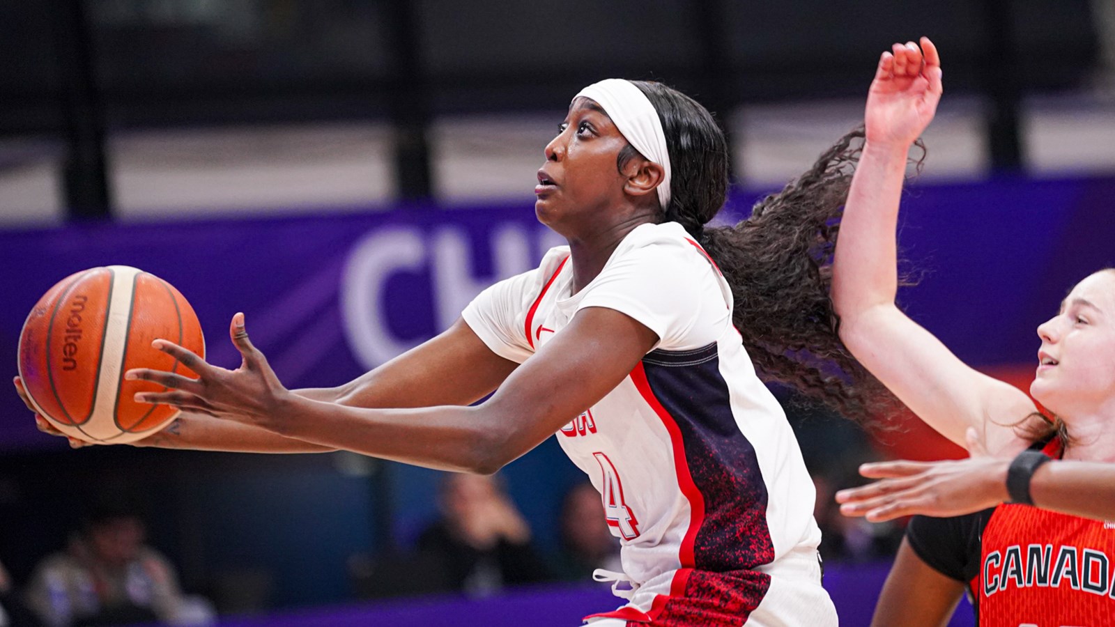 Flau'jae Johnson scoops the underhand layup for Team USA