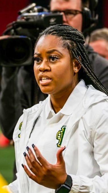 Coach Kendra Pleasants coaching on the sidelines