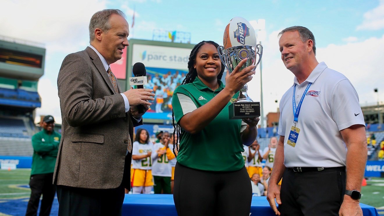 Coach Kendra Pleasants presented with the 2022 State Championship trophy