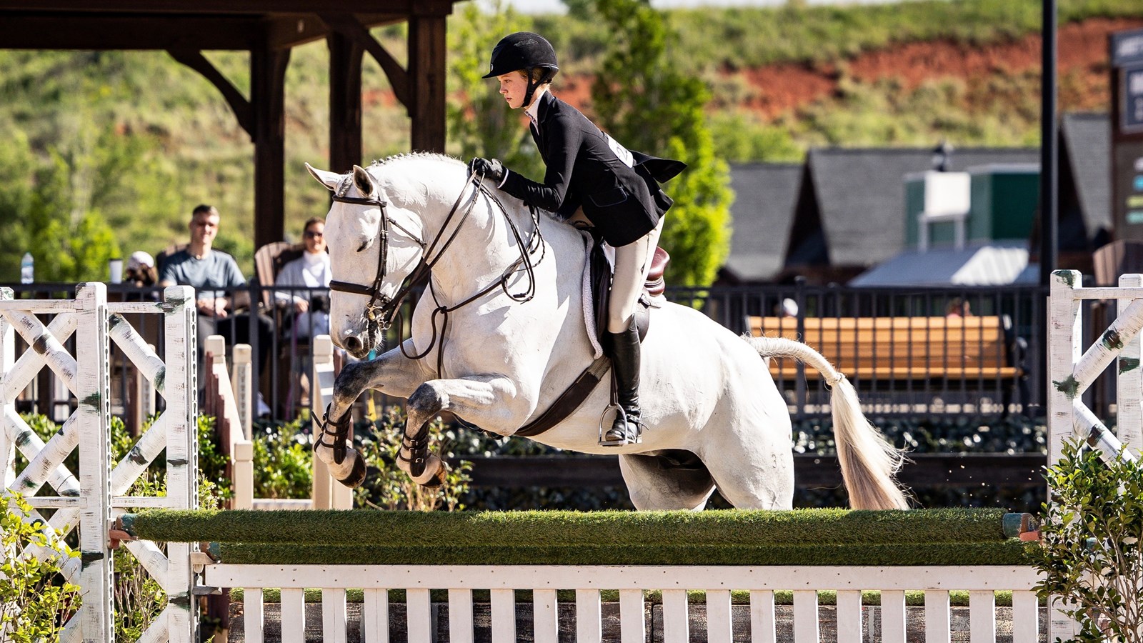 Anna is completely focused as she and the horse clear the fence