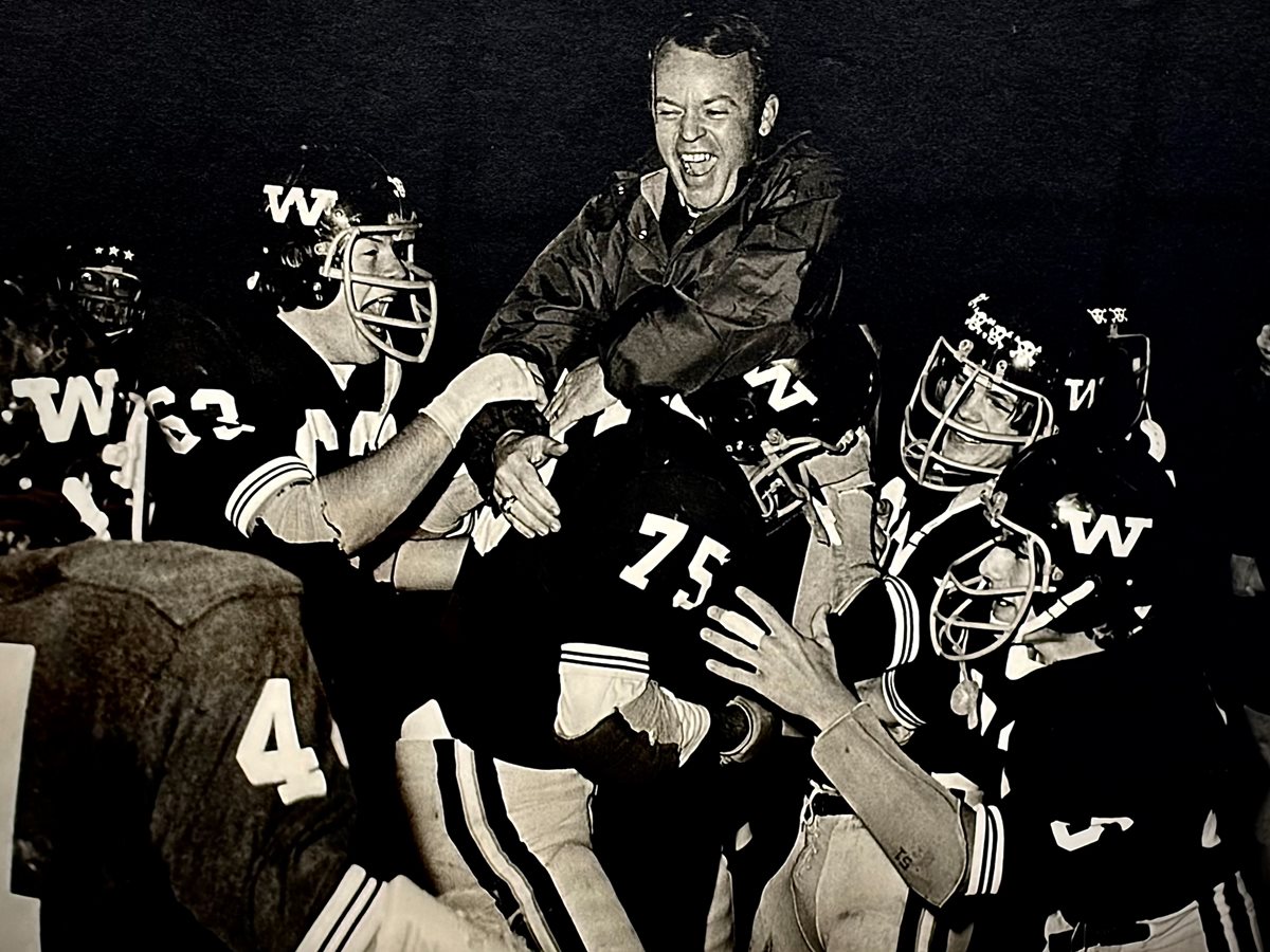 Coach Corky Kell carried off the field by his Wheeler football team