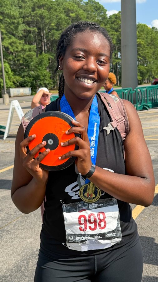 Pebblebrook's Jonae' Holder poses with her winning discus and gold medal