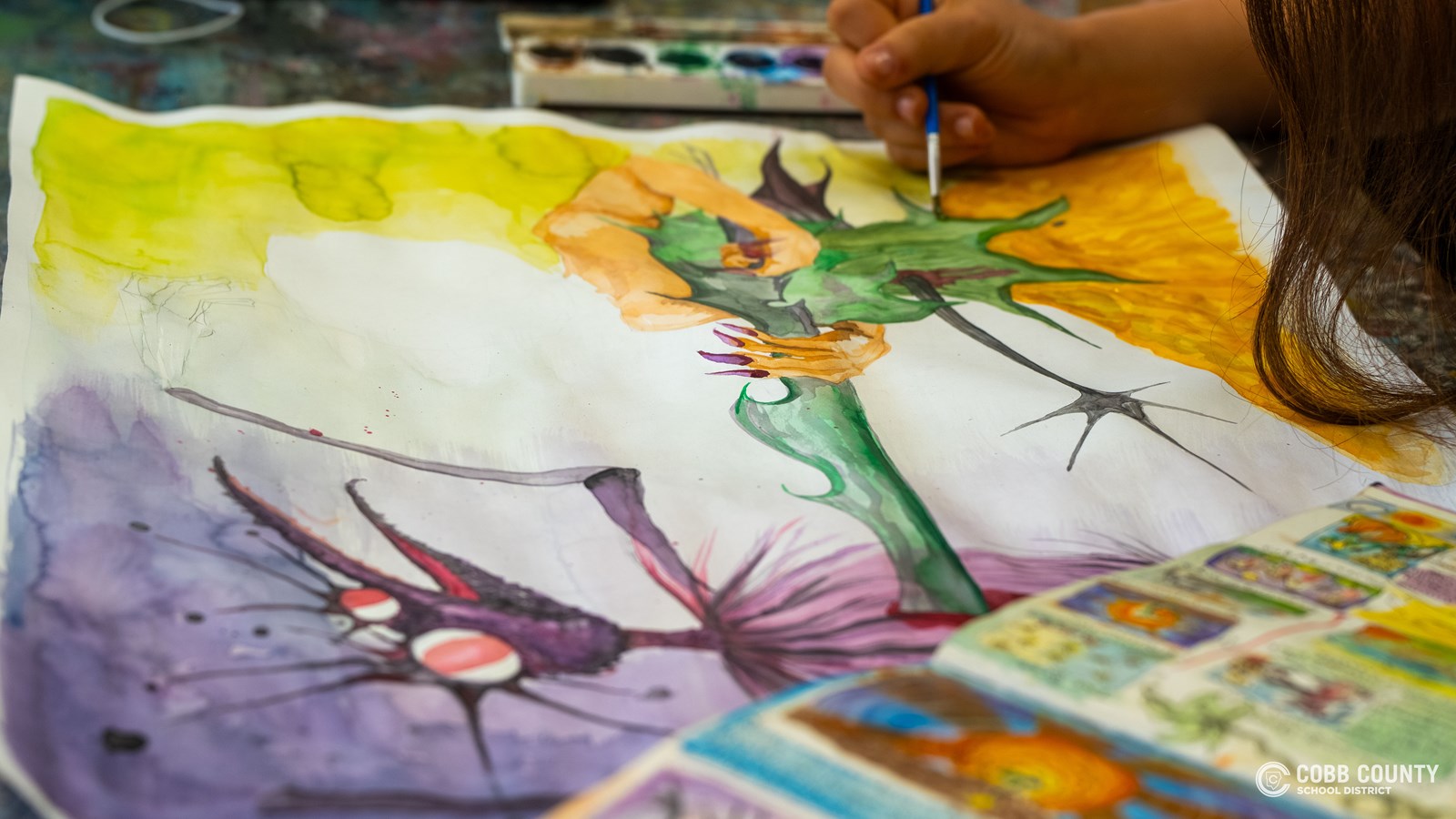 Livia Ross works on one of her art pieces.