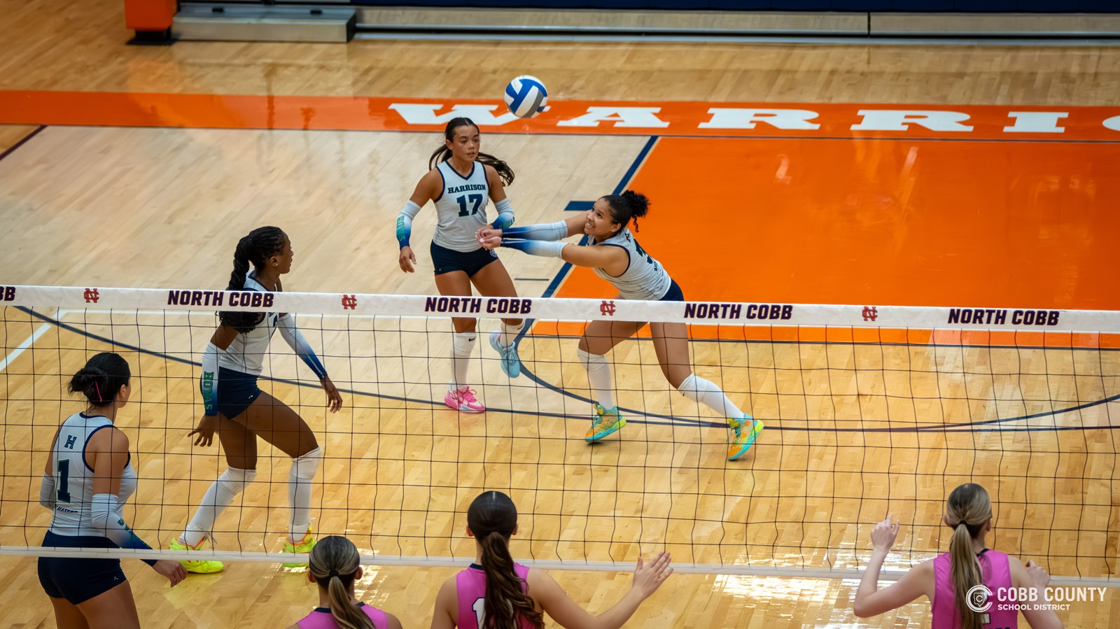 Lilah Anderson receives the serve for her Harrison Hoyas volleyball team