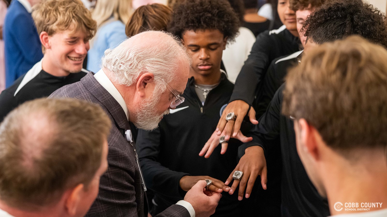 A Georgia state official checks out Campbell's championship rings