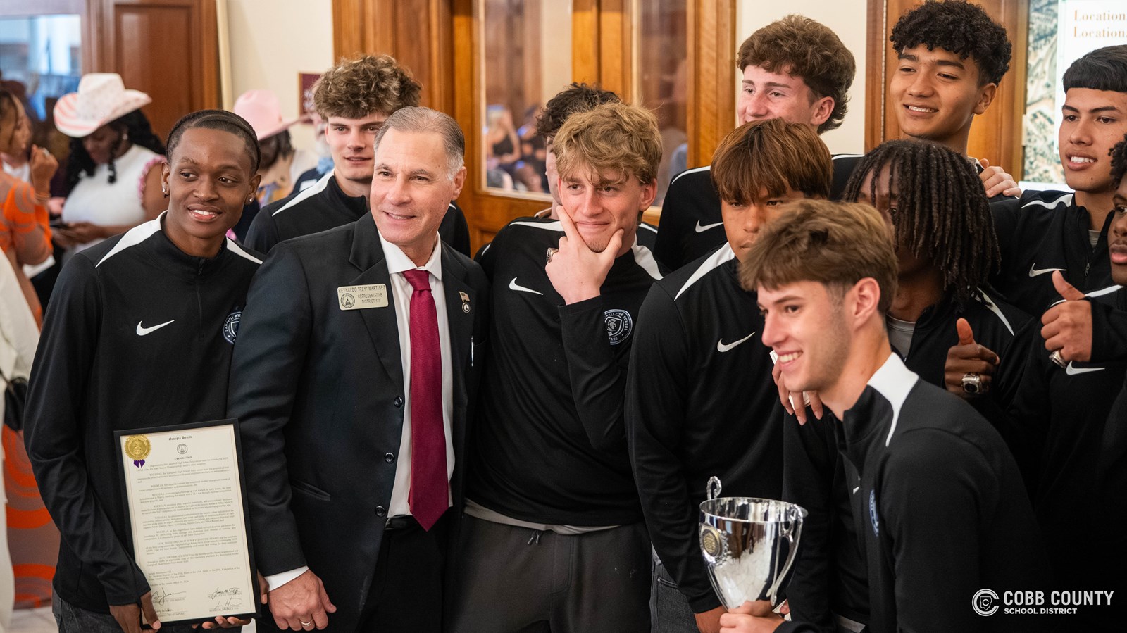 Campbell players pose with a State Representative