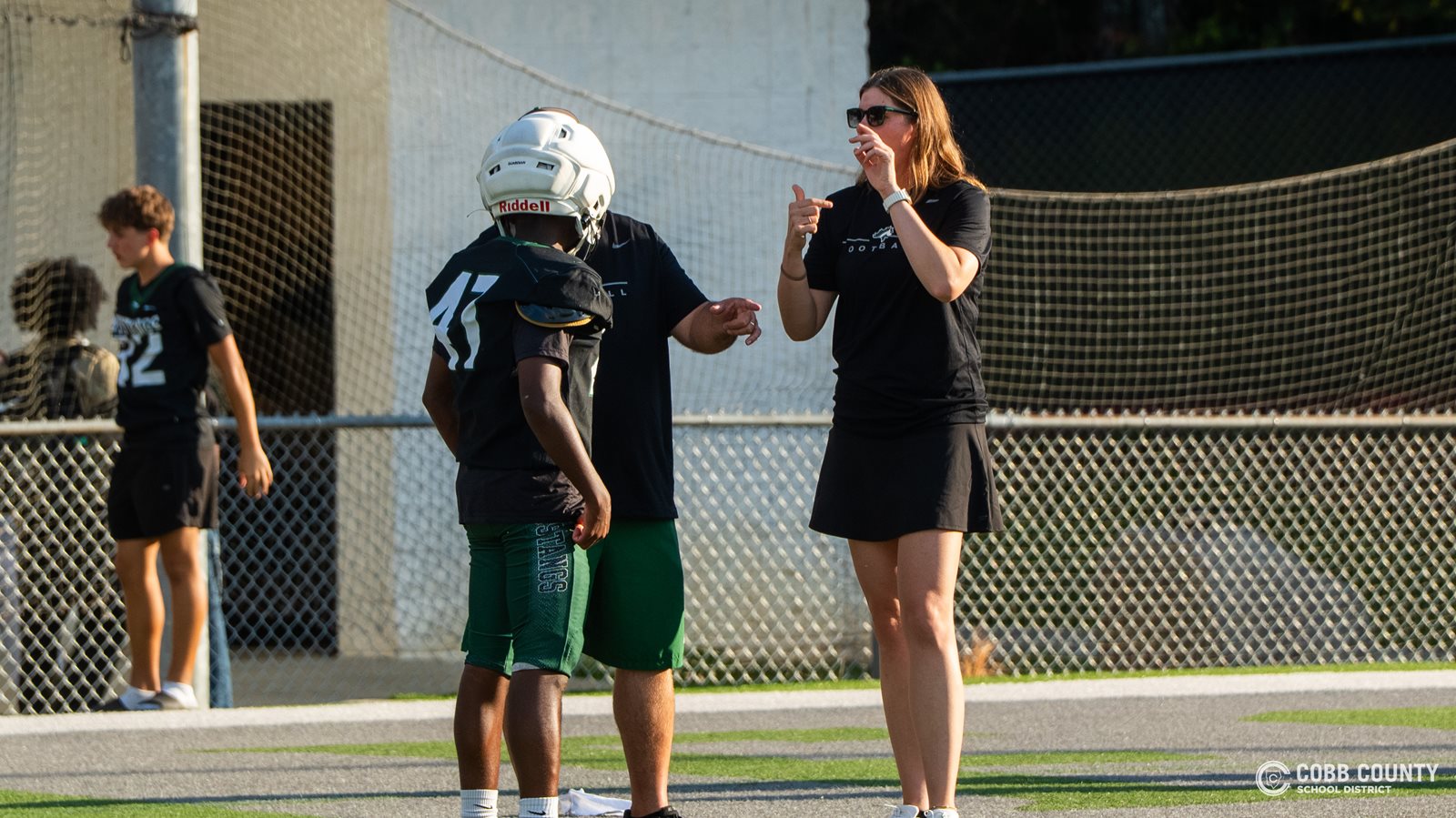 Coach Jarvis interprets the coach's directions to Larenzo