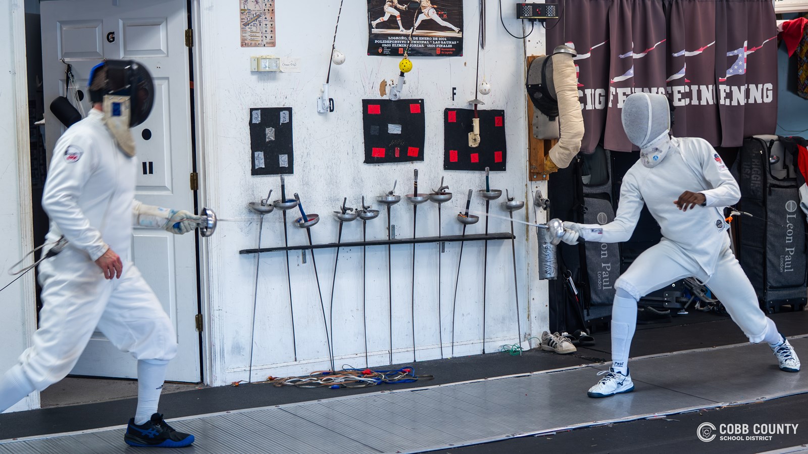 Joshua Riggins (R) has his opponent in retreat