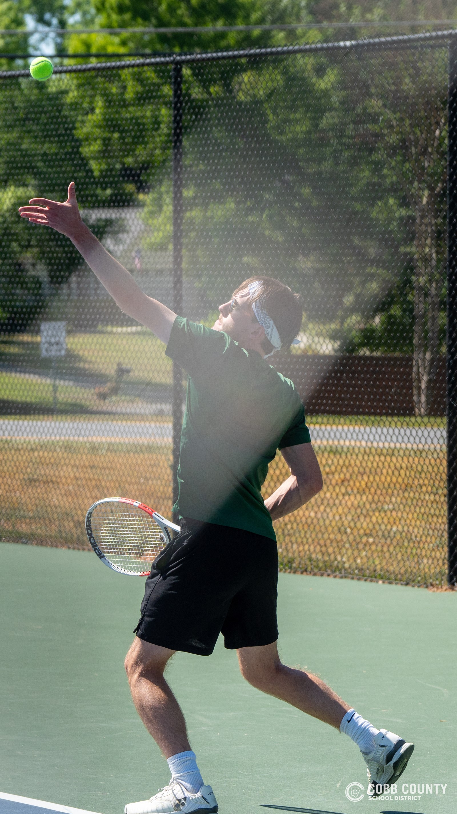 Nolen Jarl tosses ball on serve