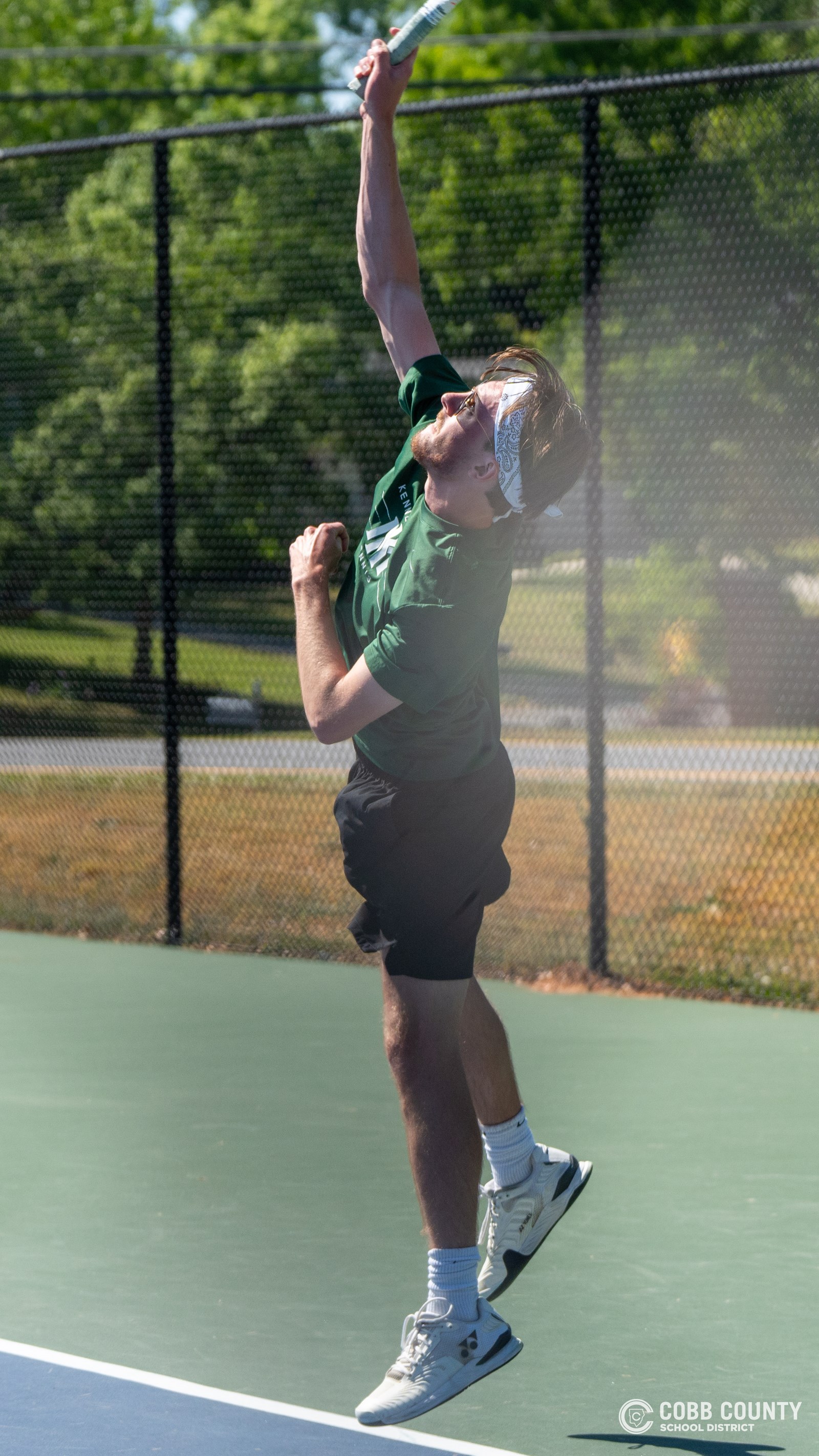 Nolen Jarl strikes the serve