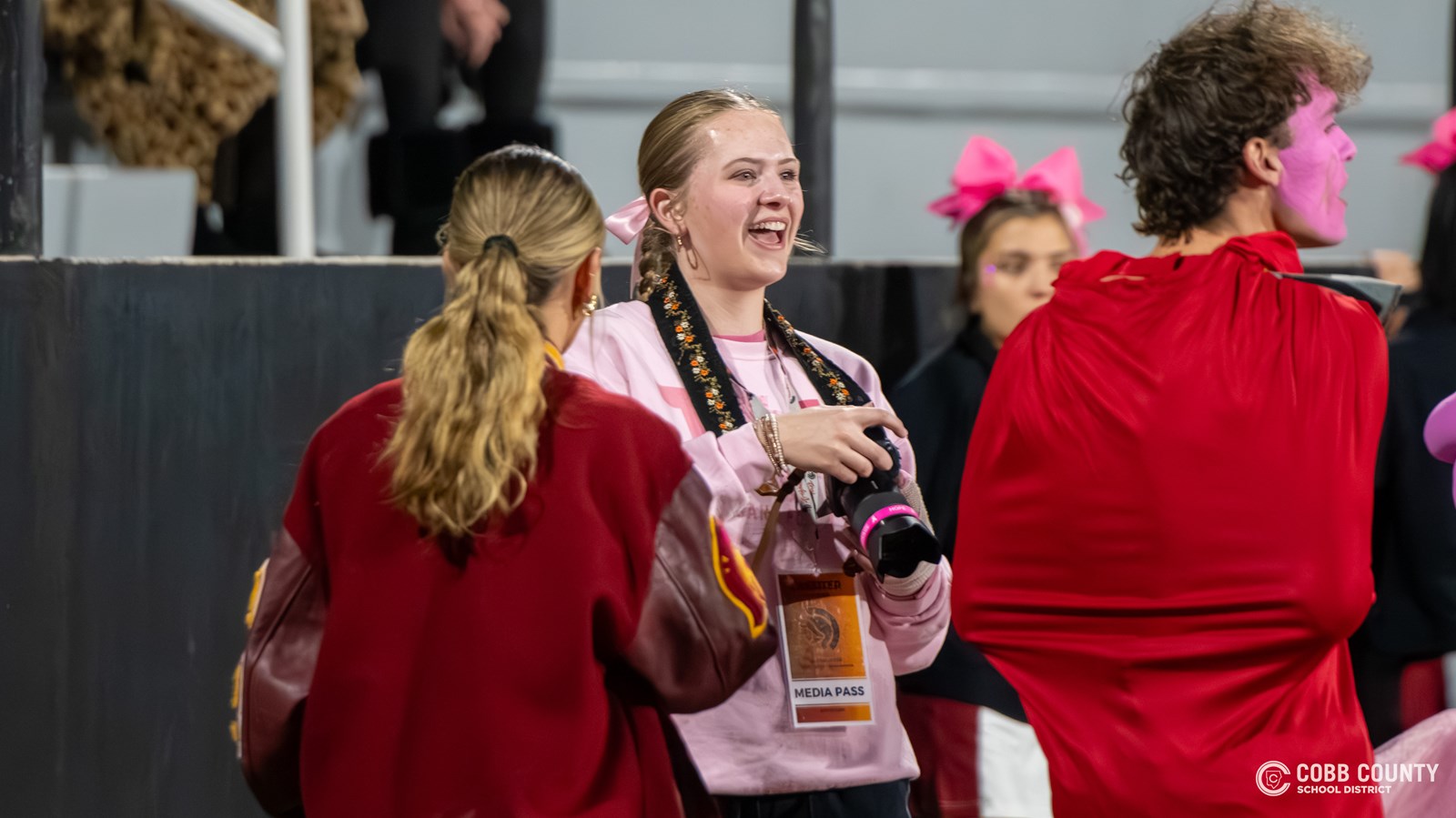 Audrey Moss surrounded by Lassiter students