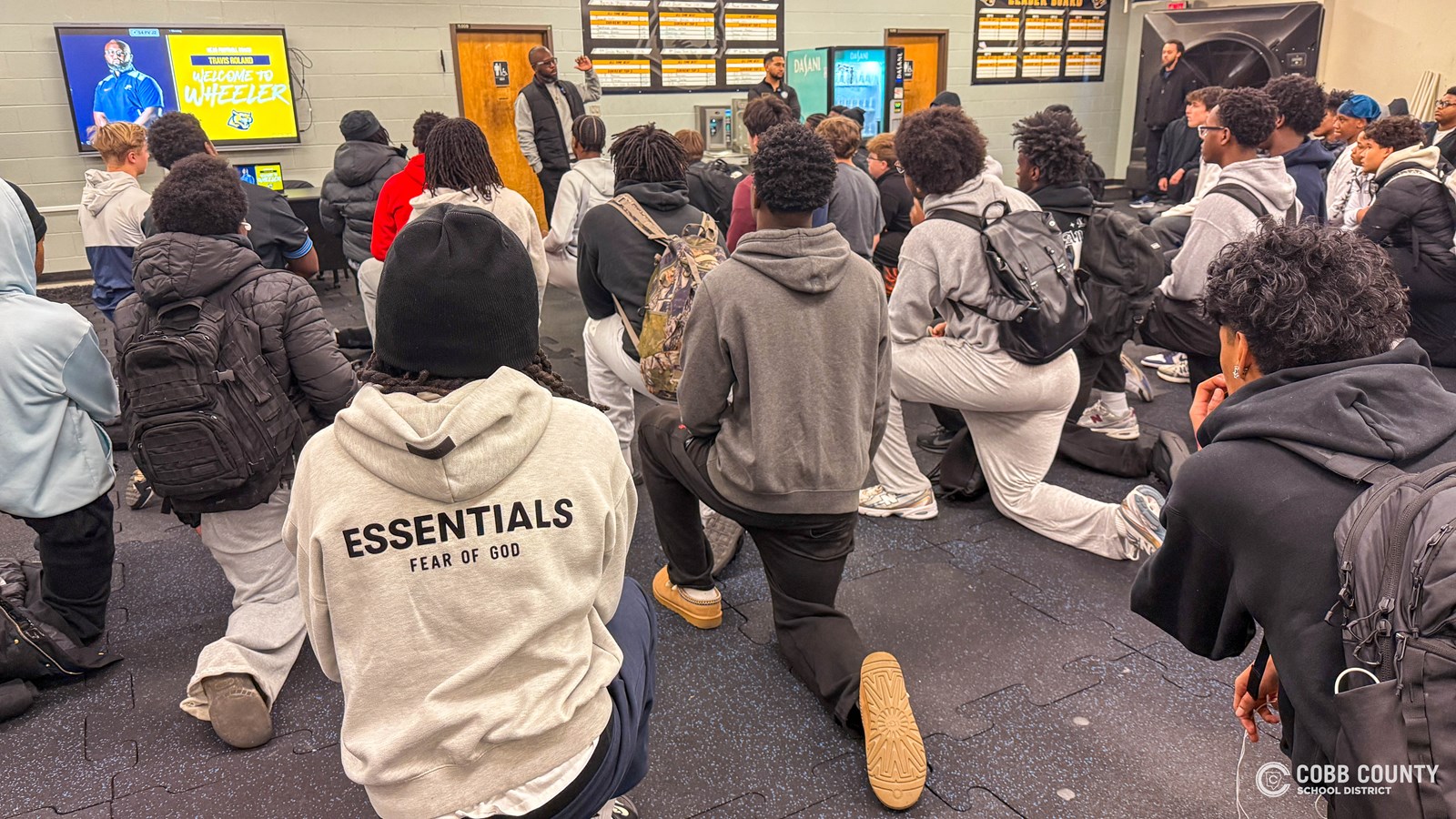 Coach Travis Roland addresses his new team.