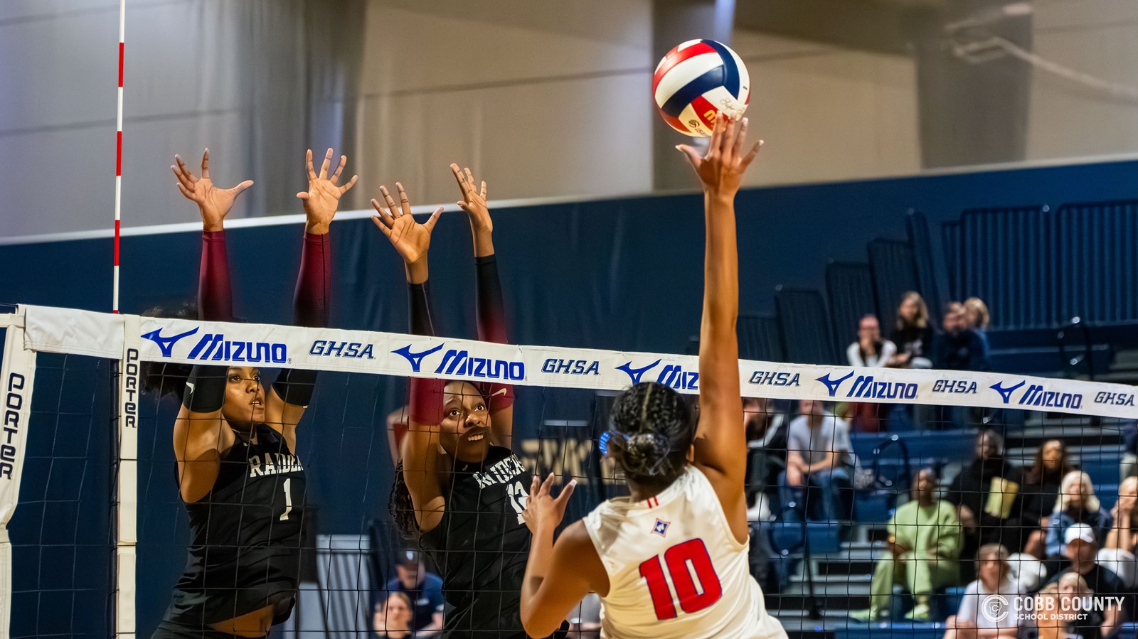 Walton senior Ashlee Gomes rises for the kill
