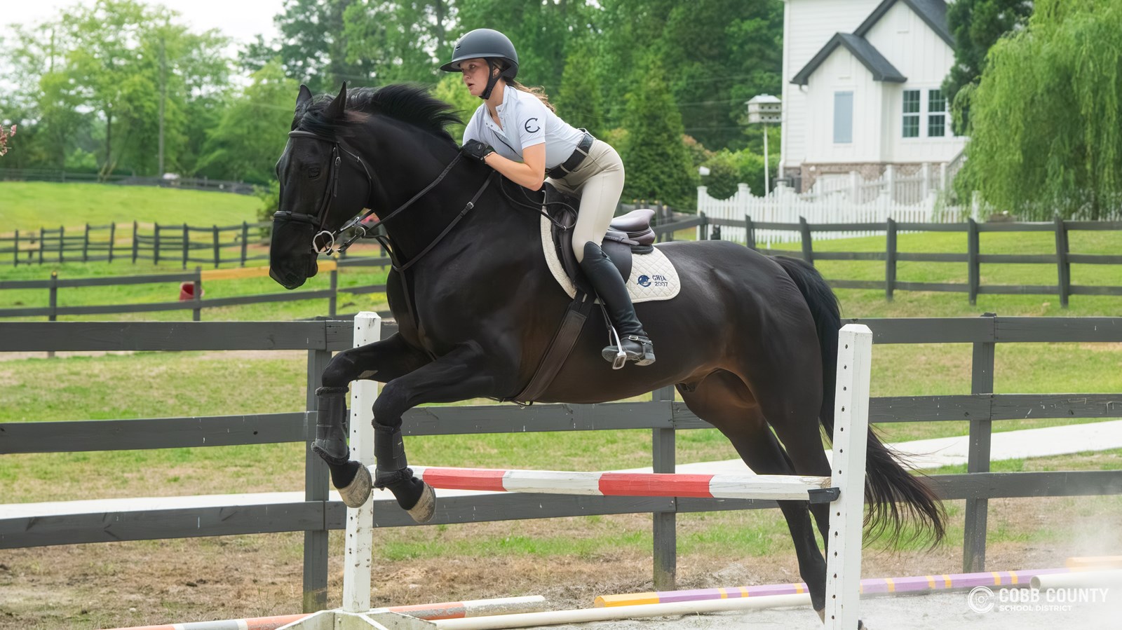 Anna and Boo clear the training fence