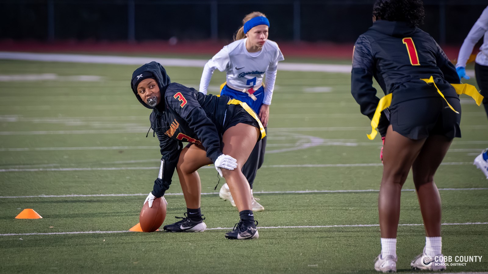 Khamiyah preparing to snap the ball