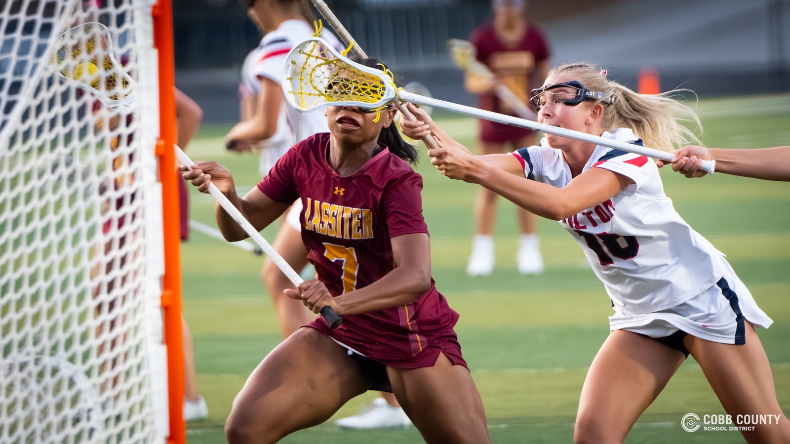 Lassiter's Ava Hardy gets off a shot while being face-guarded