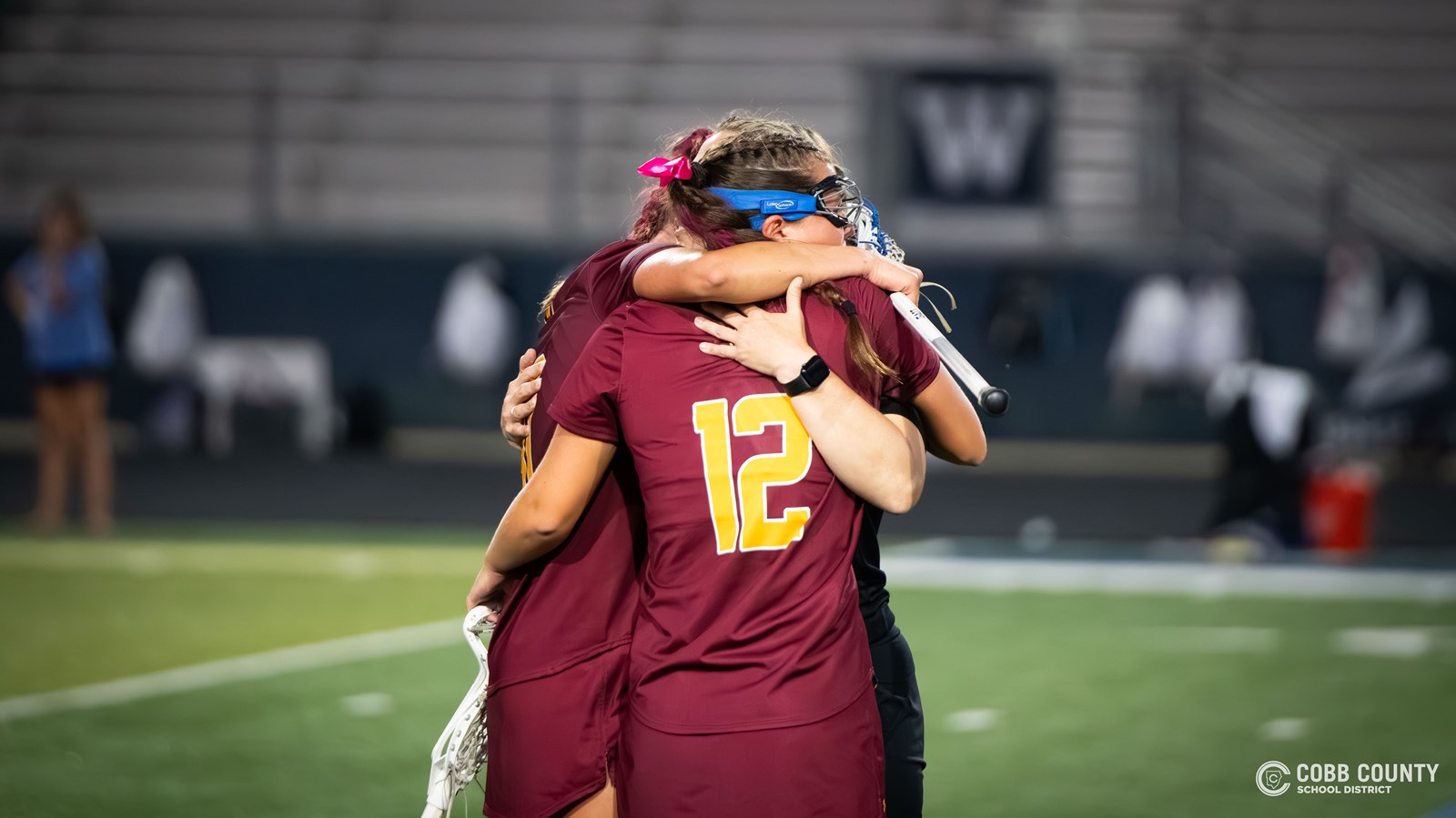 Lassiter teammates console each other after their loss