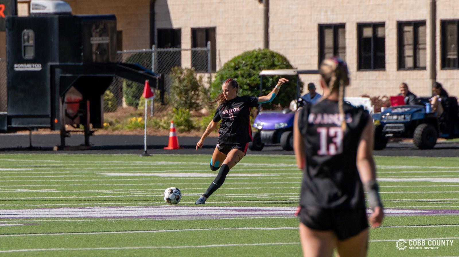 Walton junior Jordynn Gunn unleashes a free kick