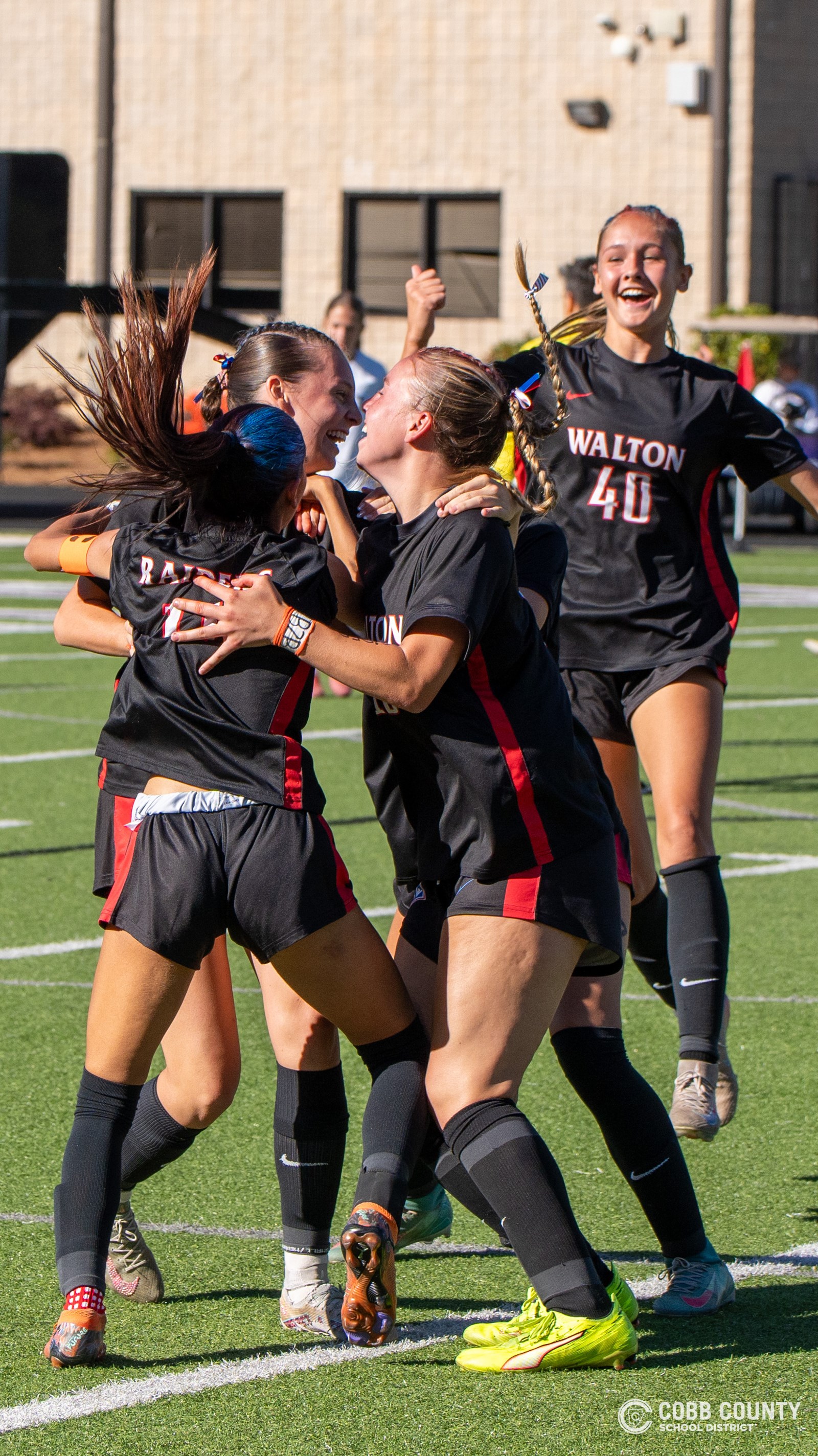 Walton girls mob the goal scorer