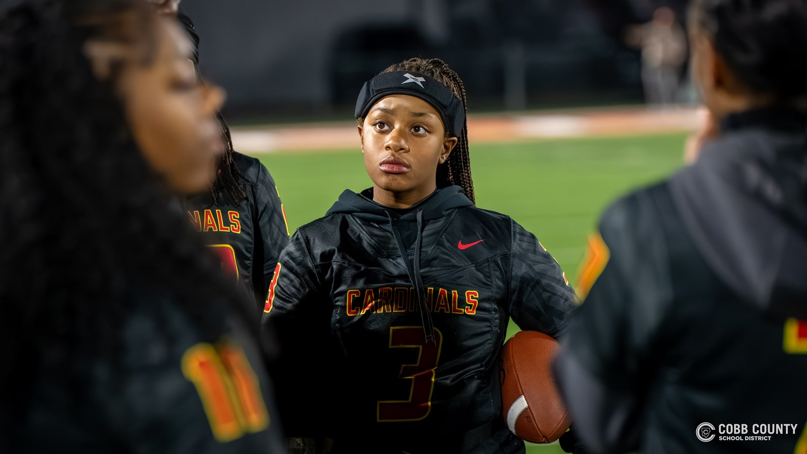 Khamiyah listening on the sidelines