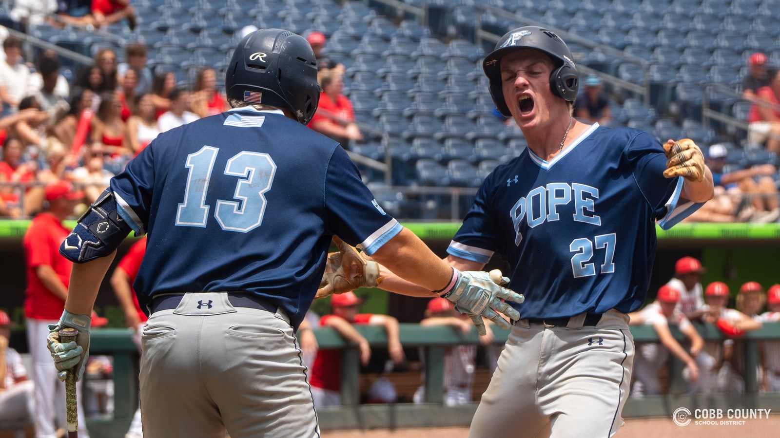 Pope senior Ben Hill welcomes junior Brayden Slorahn home 