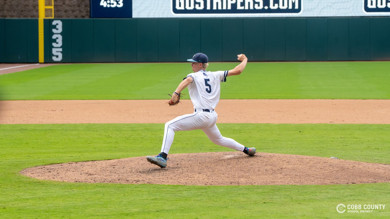 Pope senior Davis Smith fires a pitch home