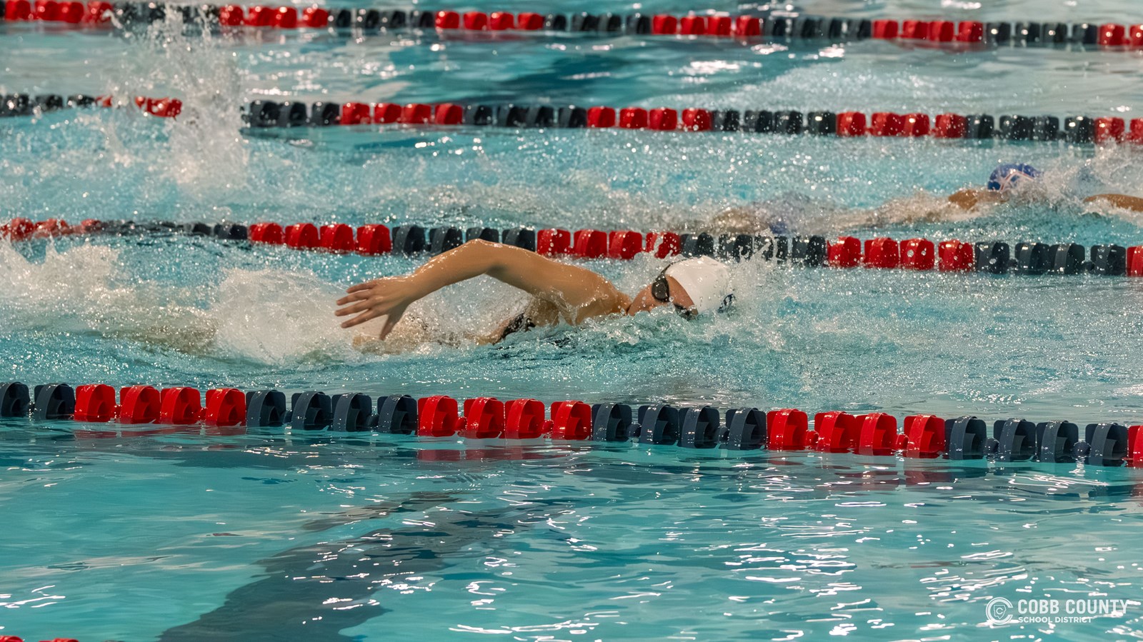 Isabella Parrenas swimming a freestyle race