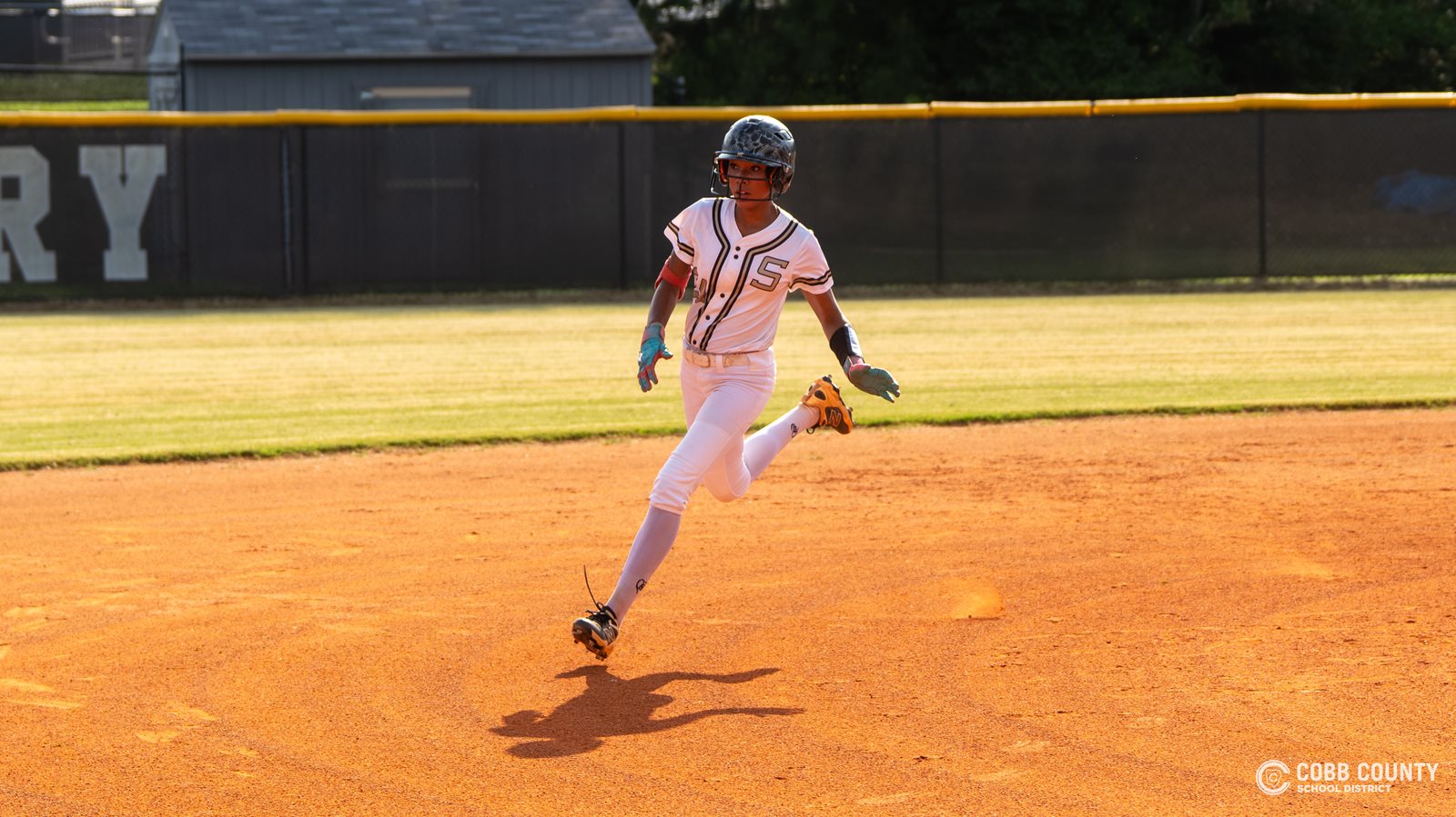 Sprayberry's Kristian Dorsey readies to round third base and head home