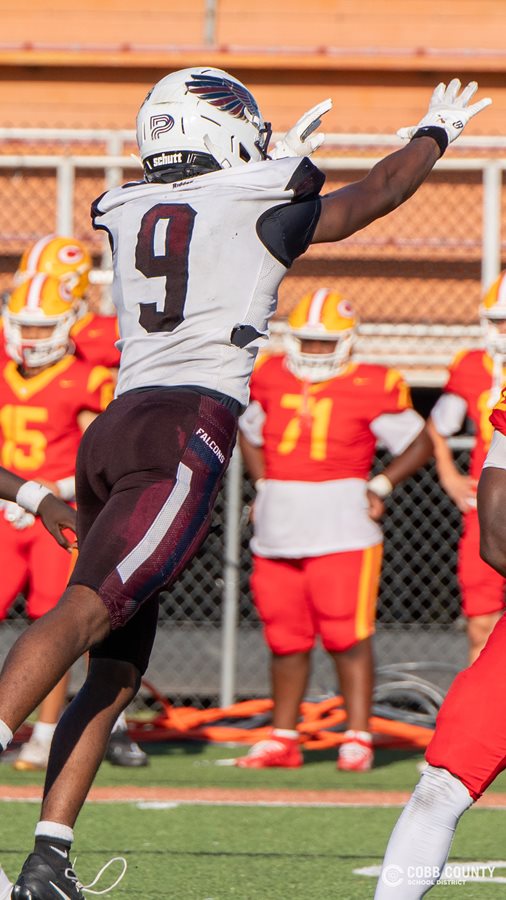 Pebblebrook's Ne'cho Benton leaps at the opposing QB
