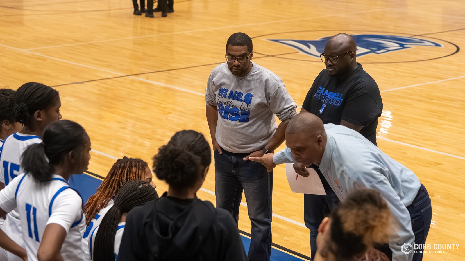 Campbell Assistant Coach Terrell Johnson looks on as Head Coach Randy McClure instructs the team