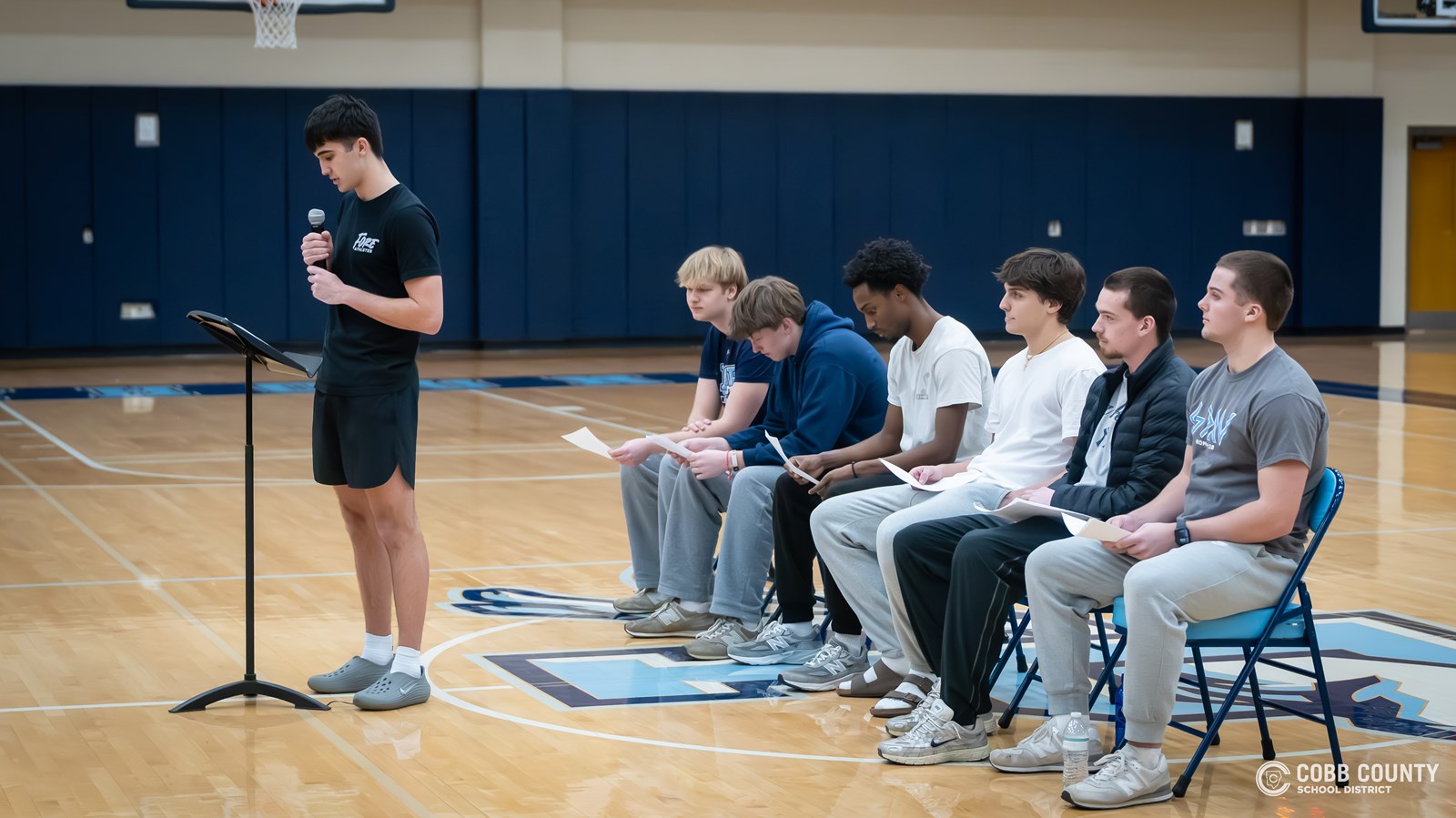 Pope senior Beck Chaney reads his letter to the crowd