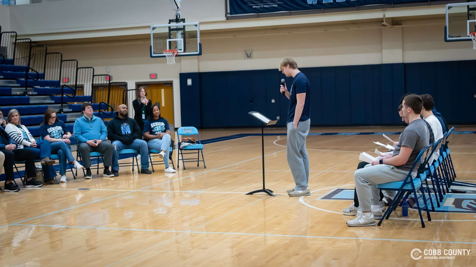 Pope senior Wyatt Zellers takes his turn at the microphone
