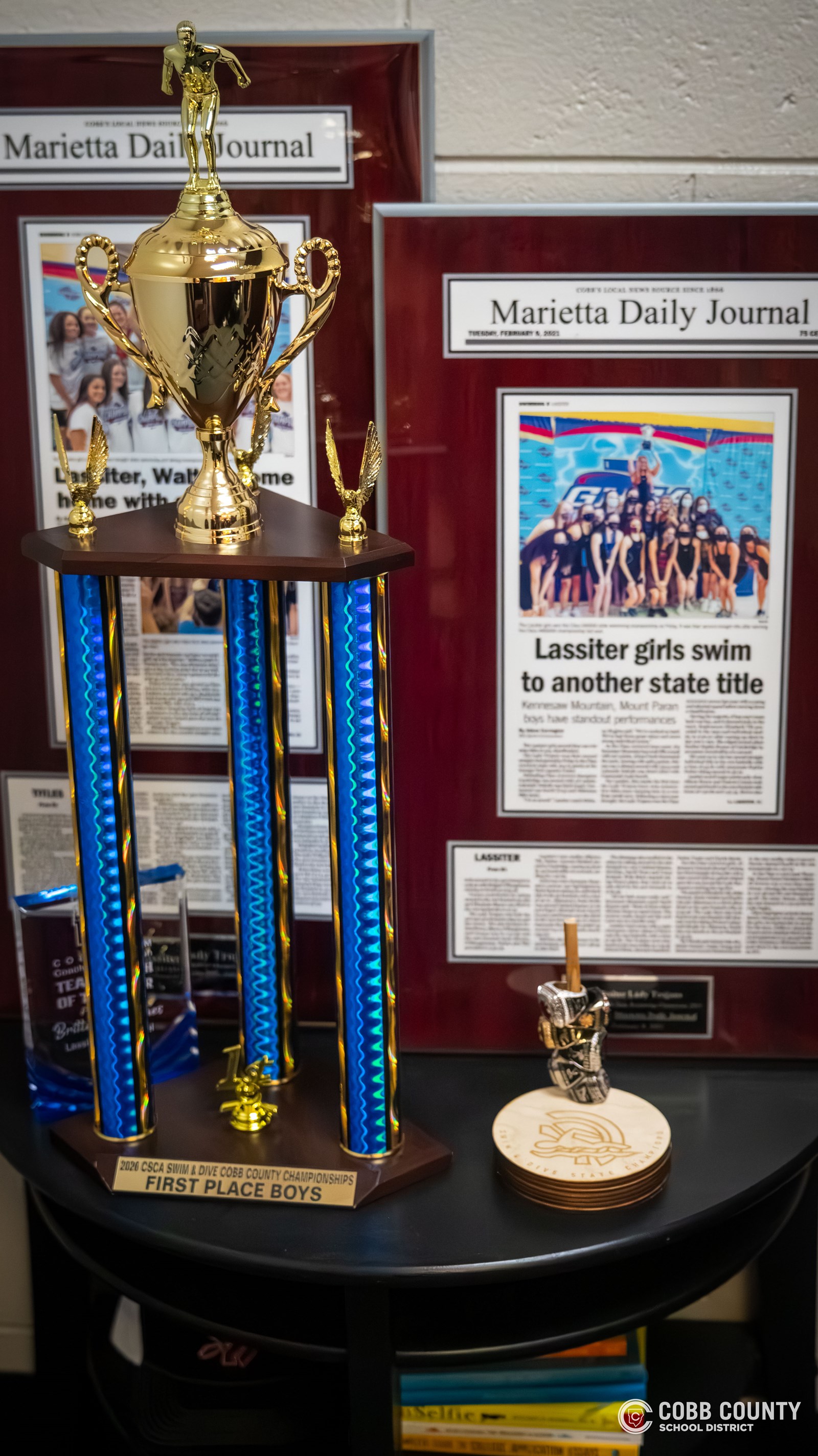 Trophies and framed articles in Coach Hughes' office