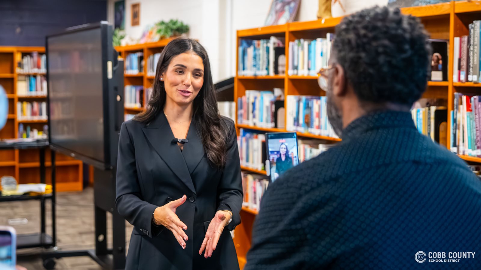 Ashley ShahAhmadi helps Mr. Cook with some content creation