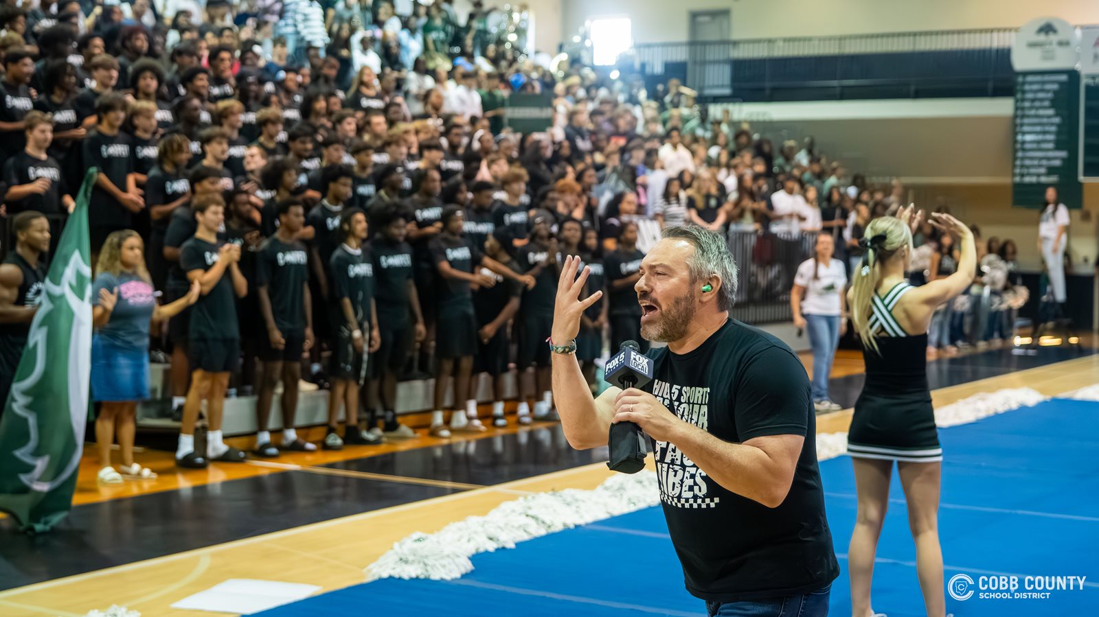 FOX 5's Paul Milliken gives the High 5 Sport signal to the camera