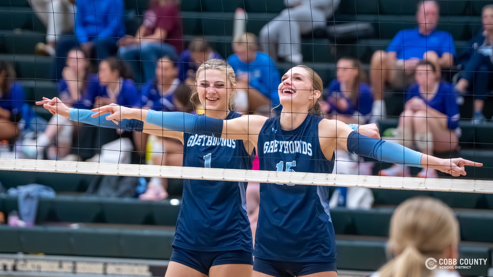 Pope's Lynden Harvey and Julianne Kopach have a laugh at the net