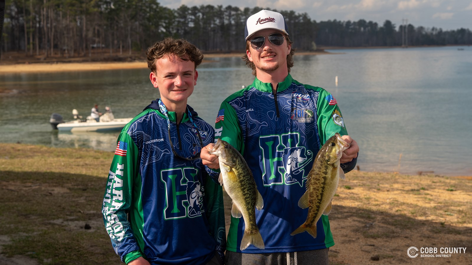 Harrison's Anderson Paul and Will Adkison pose with their bass