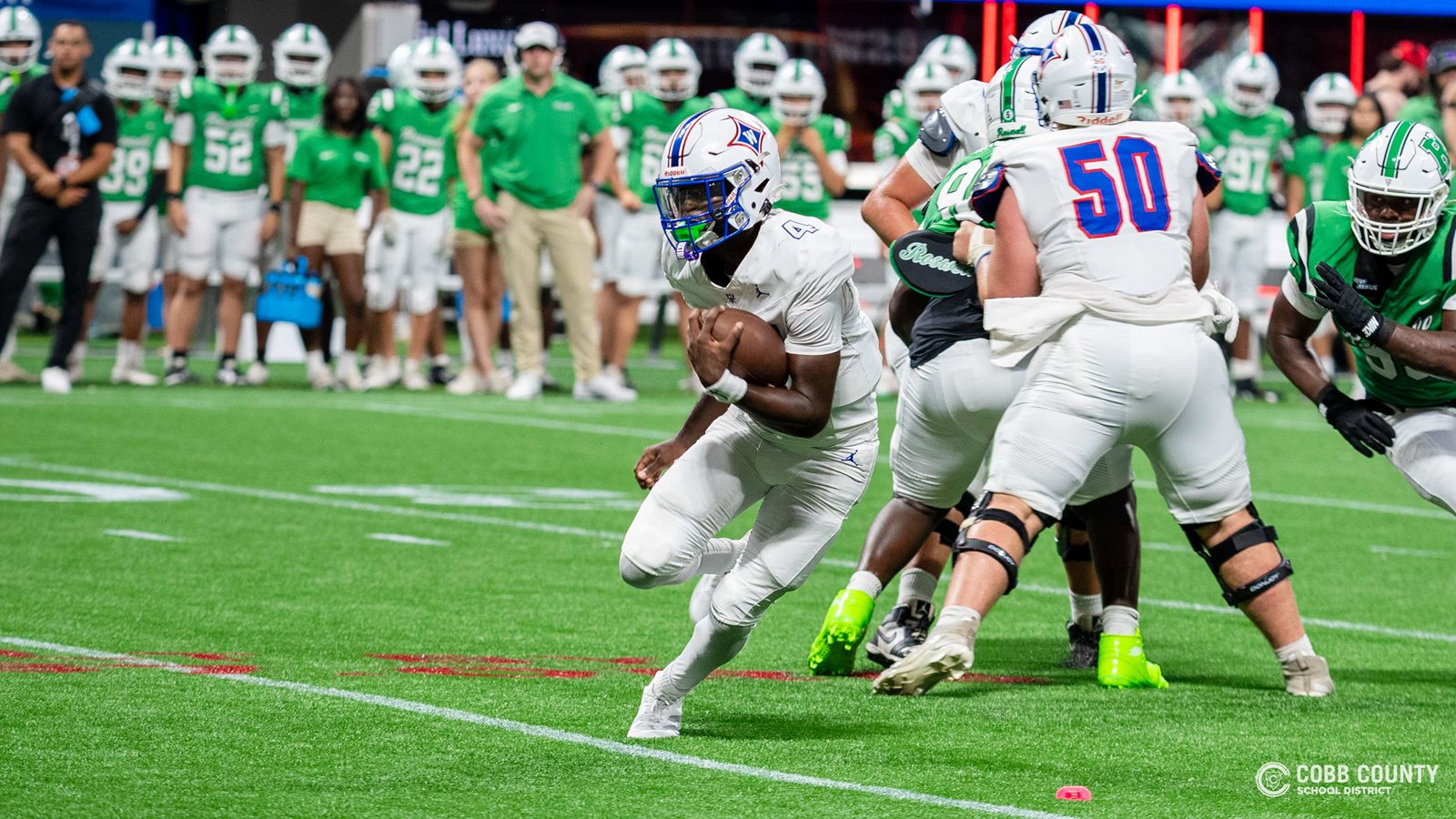 Walton's Christion Peacock scrambles for rushing yards