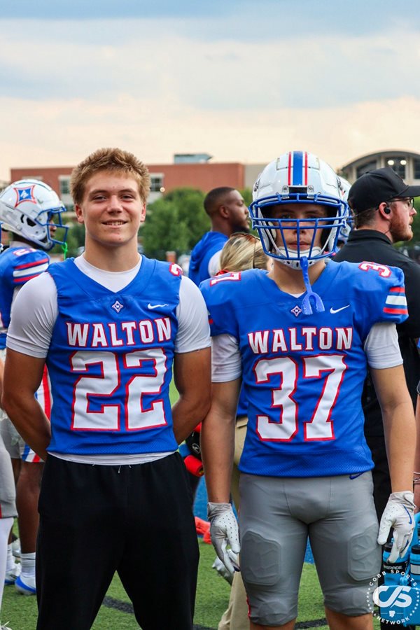 Walton's Rocky (22) and Nash (37) Burns pose pregame