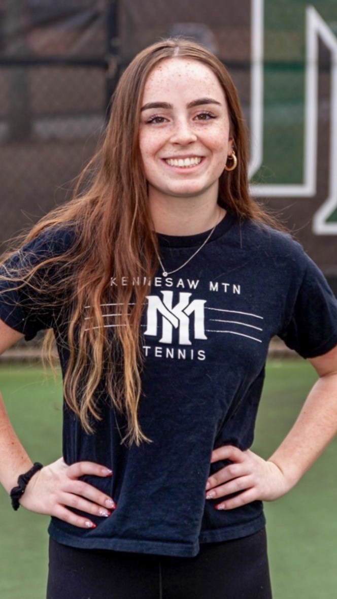 Gabby Ertle poses as the KMHS girls tennis team manager