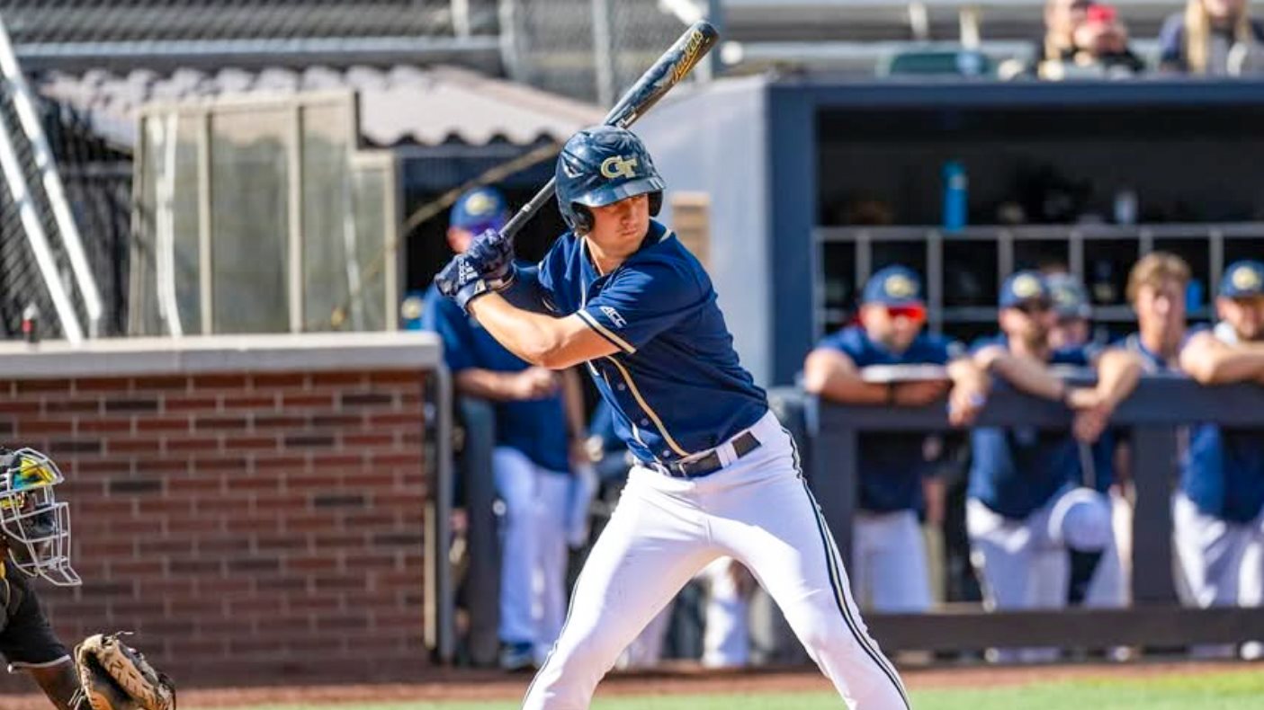 Carson Kerce sizes up the pitch while at bat for the Yellow Jackets