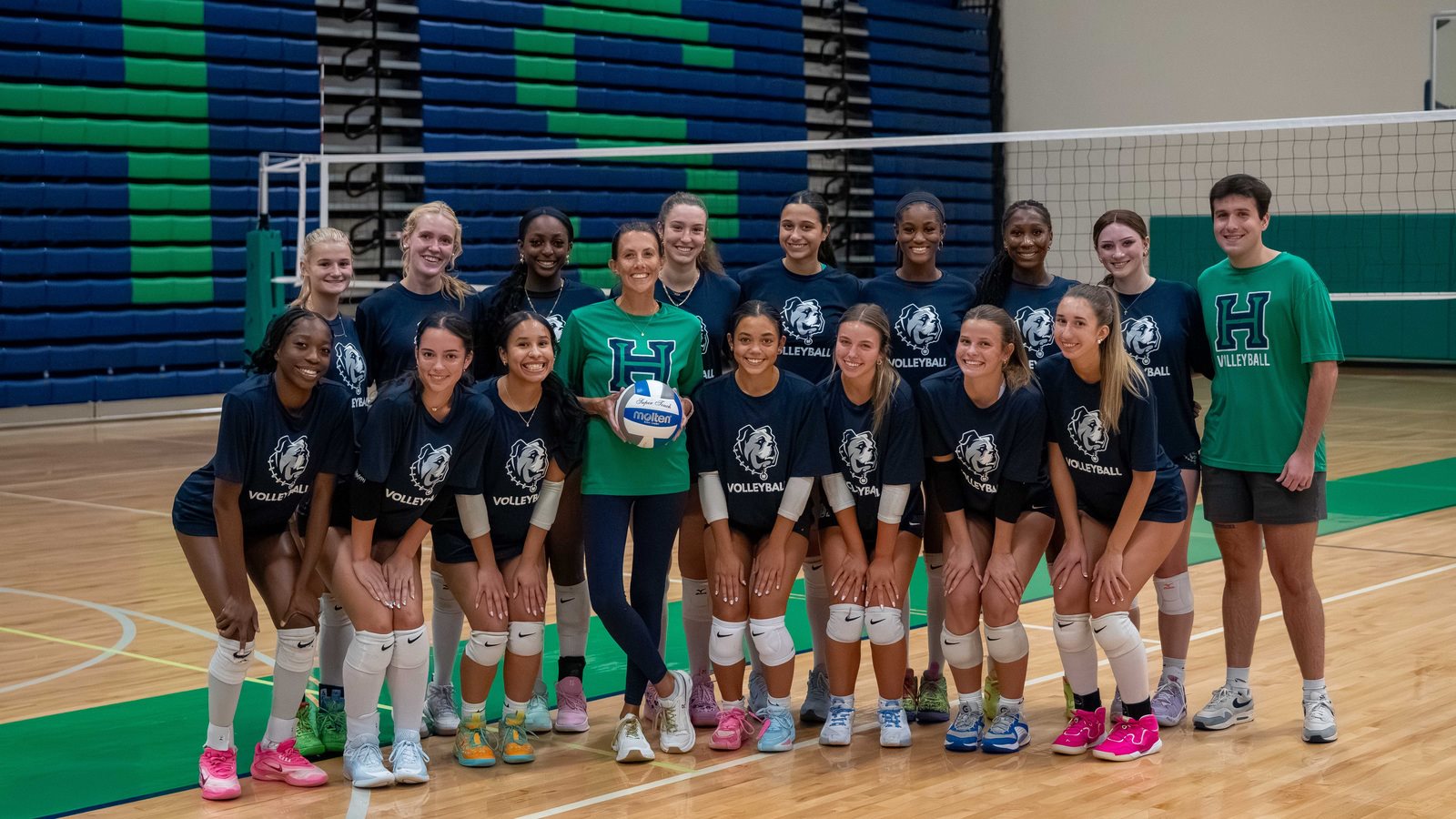 Harrison volleyball players gathered with their team