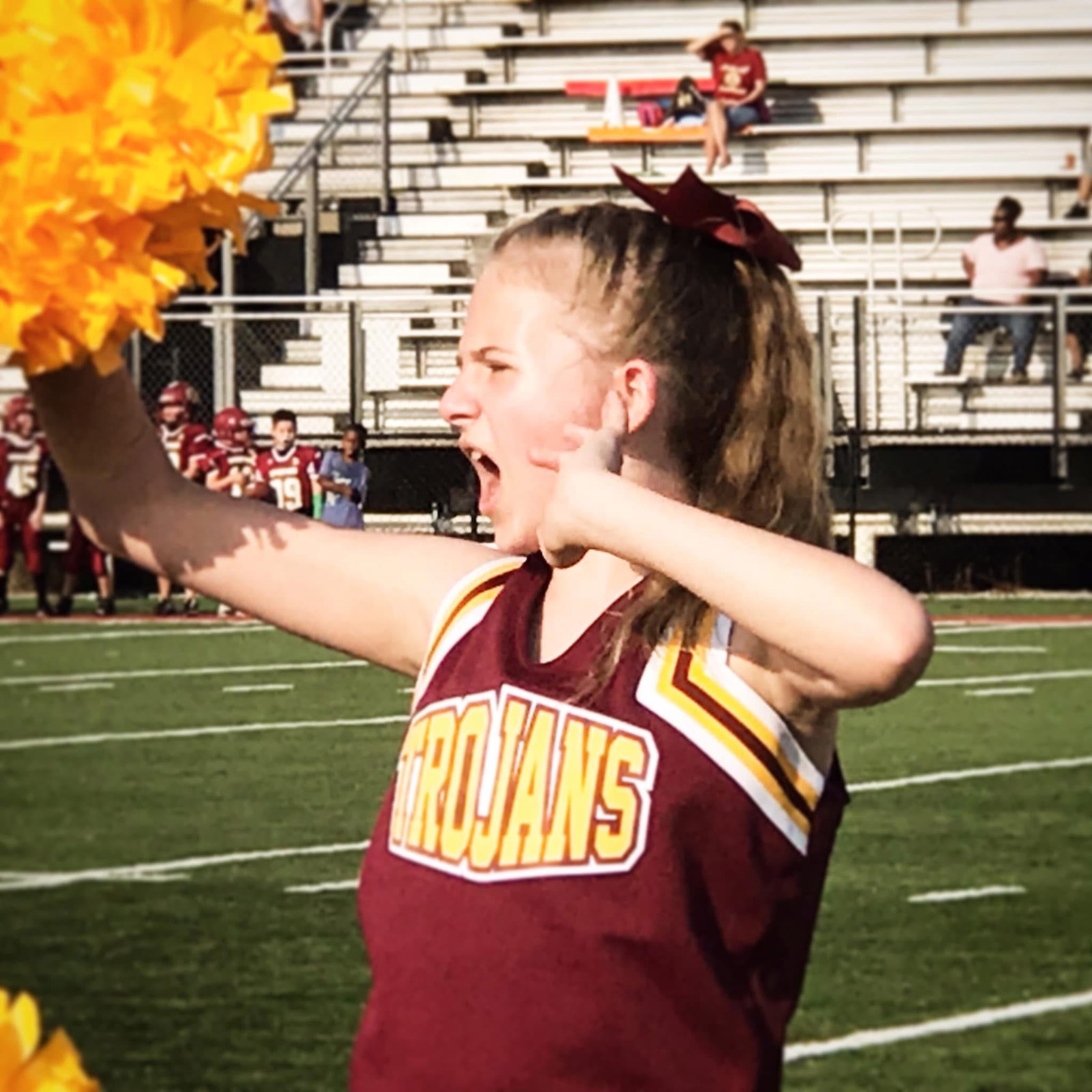 Audrey Moss cheering for the middle school feeder program