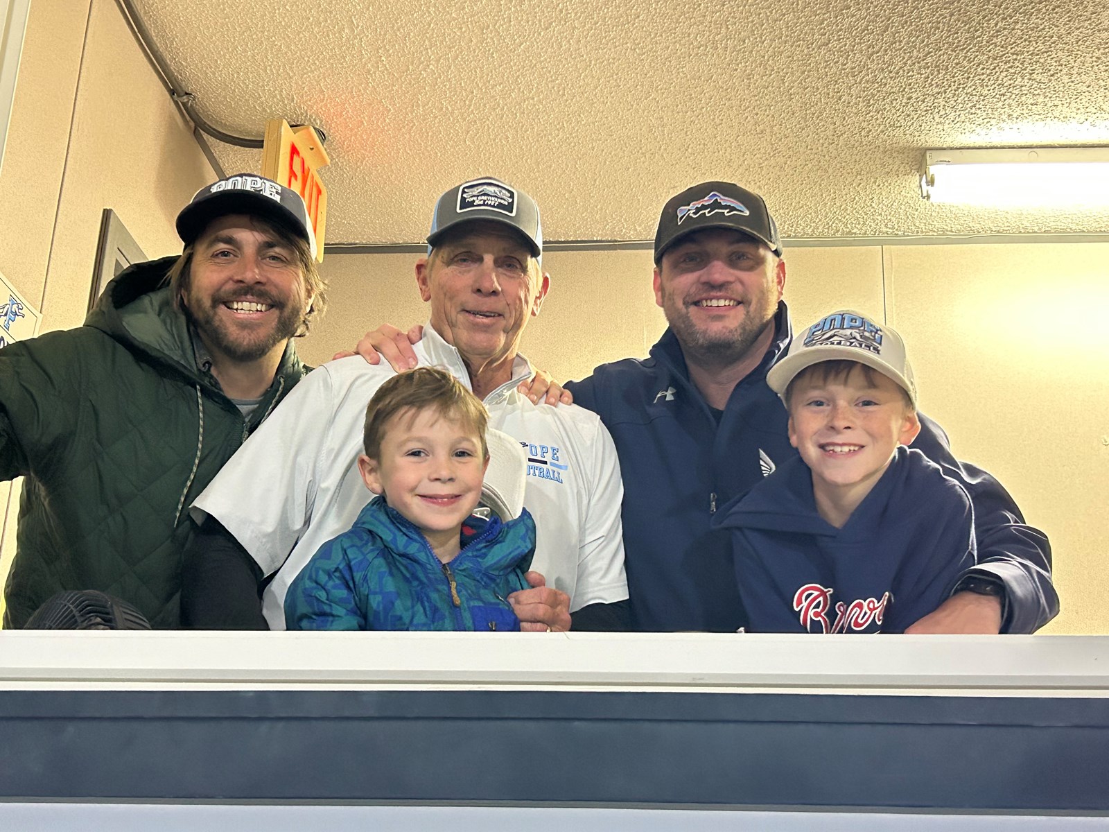 Coach Mahon with his sons and grandsons