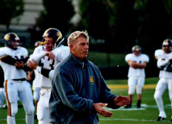 Coach Mahon encouraging Wheeler players in pregame