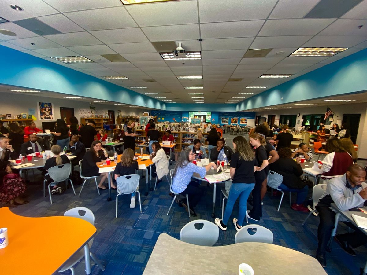 Students and visiting educators gathered in Palmer's Learning Commons for an AVID showcase.