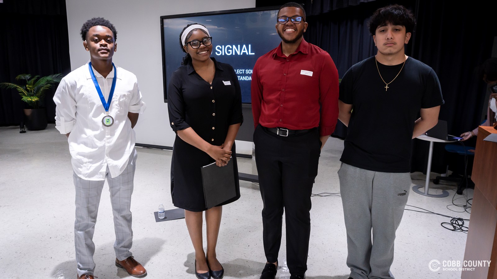 Cobb Schools students presenting speeches about community and belonging at DHH event