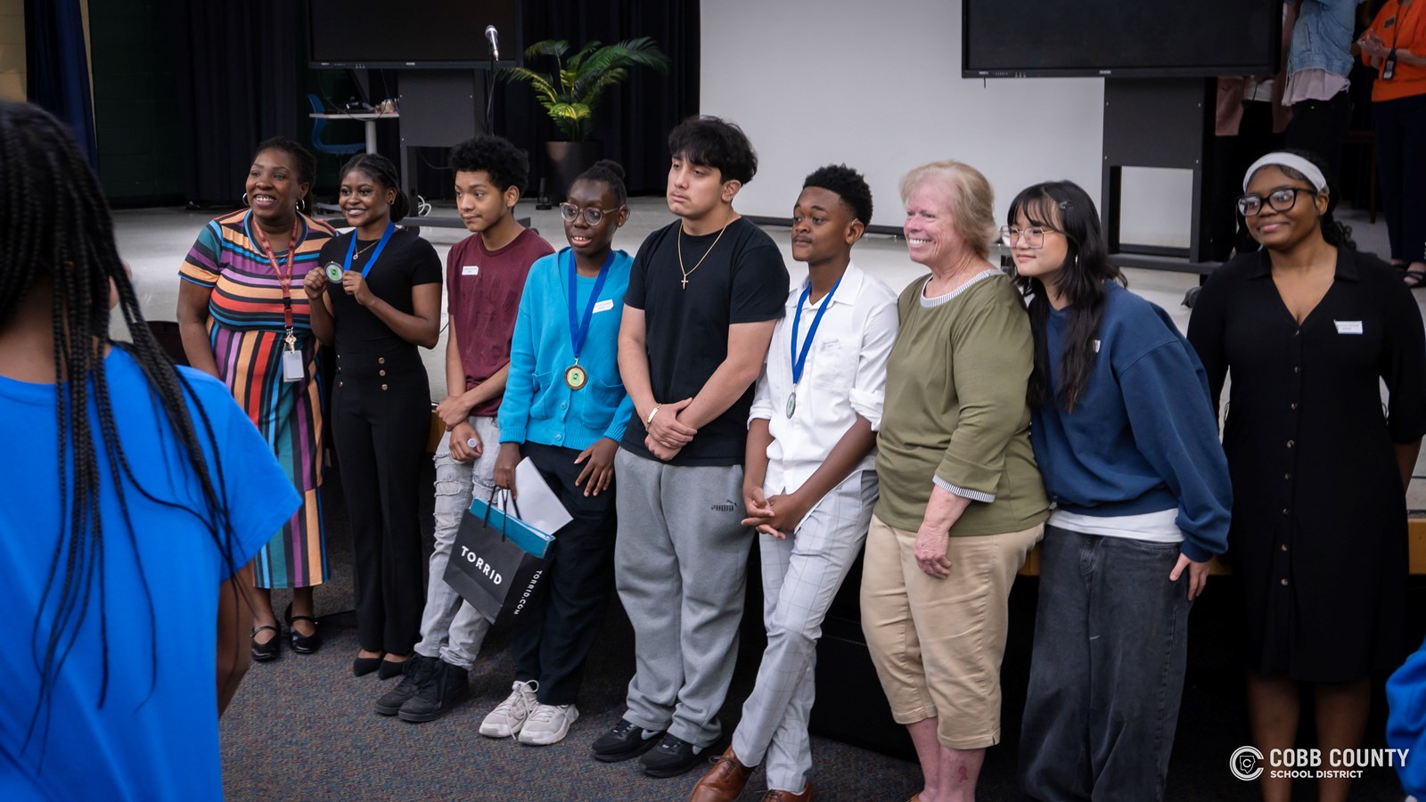 Cobb Schools students presenting speeches about community and belonging at DHH event