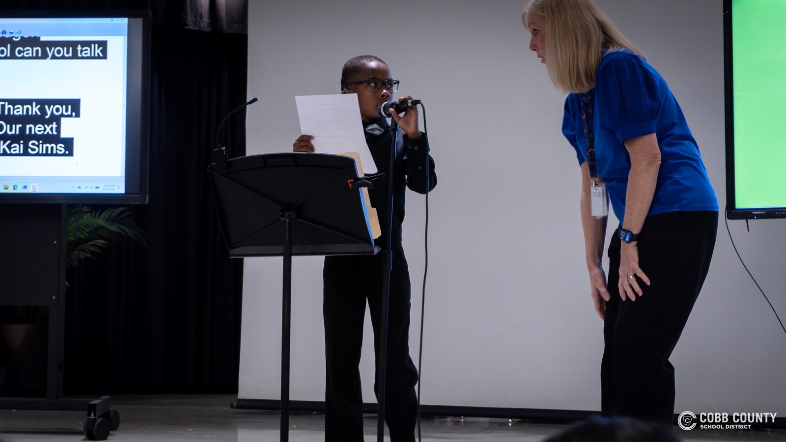 Cobb Schools students presenting speeches about community and belonging at DHH event