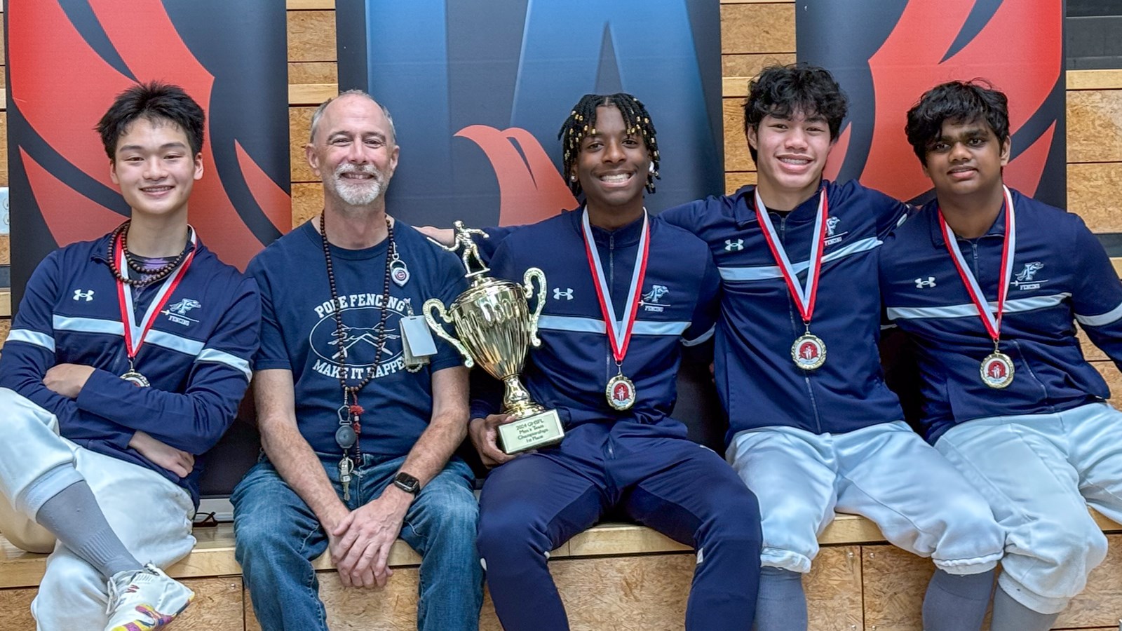 Joshua Riggins poses with the Pope fencing club after winning the 2024-2025 GHSFL state title